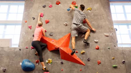 Couple indoor rock climbing