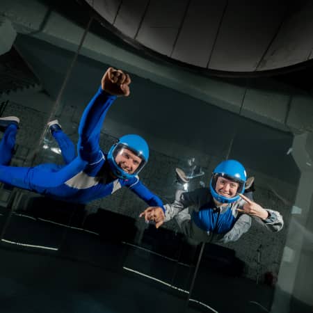 Couple skydiving indoors