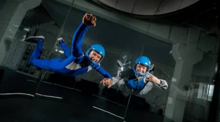 Couple skydiving indoors