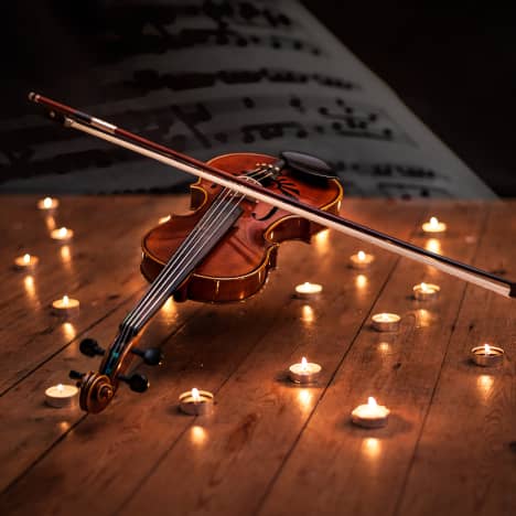 Violin Surrounded by Candles