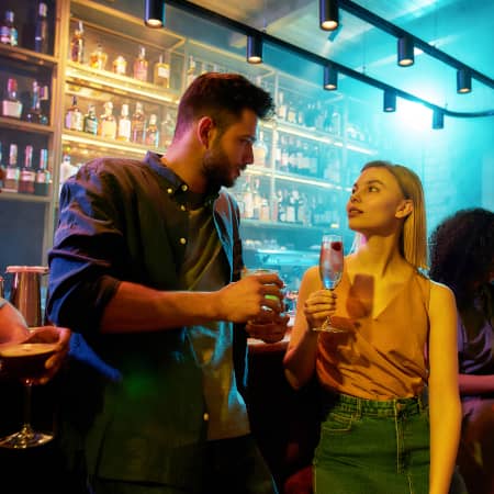 Couple having Conversation at a Bar