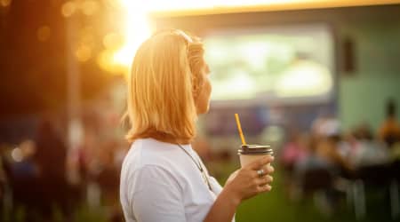 Woman watching movie outdoors